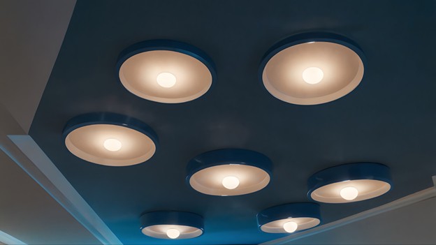 Modern ceiling spotlight arrangement providing warm ambient lighting, design inspiration by Sims Lighting Gallery Singapore.