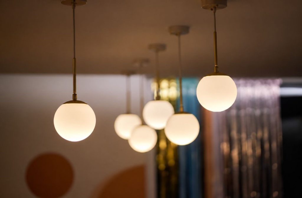 Ceiling light ideas with white globe pendant lights hanging at different heights